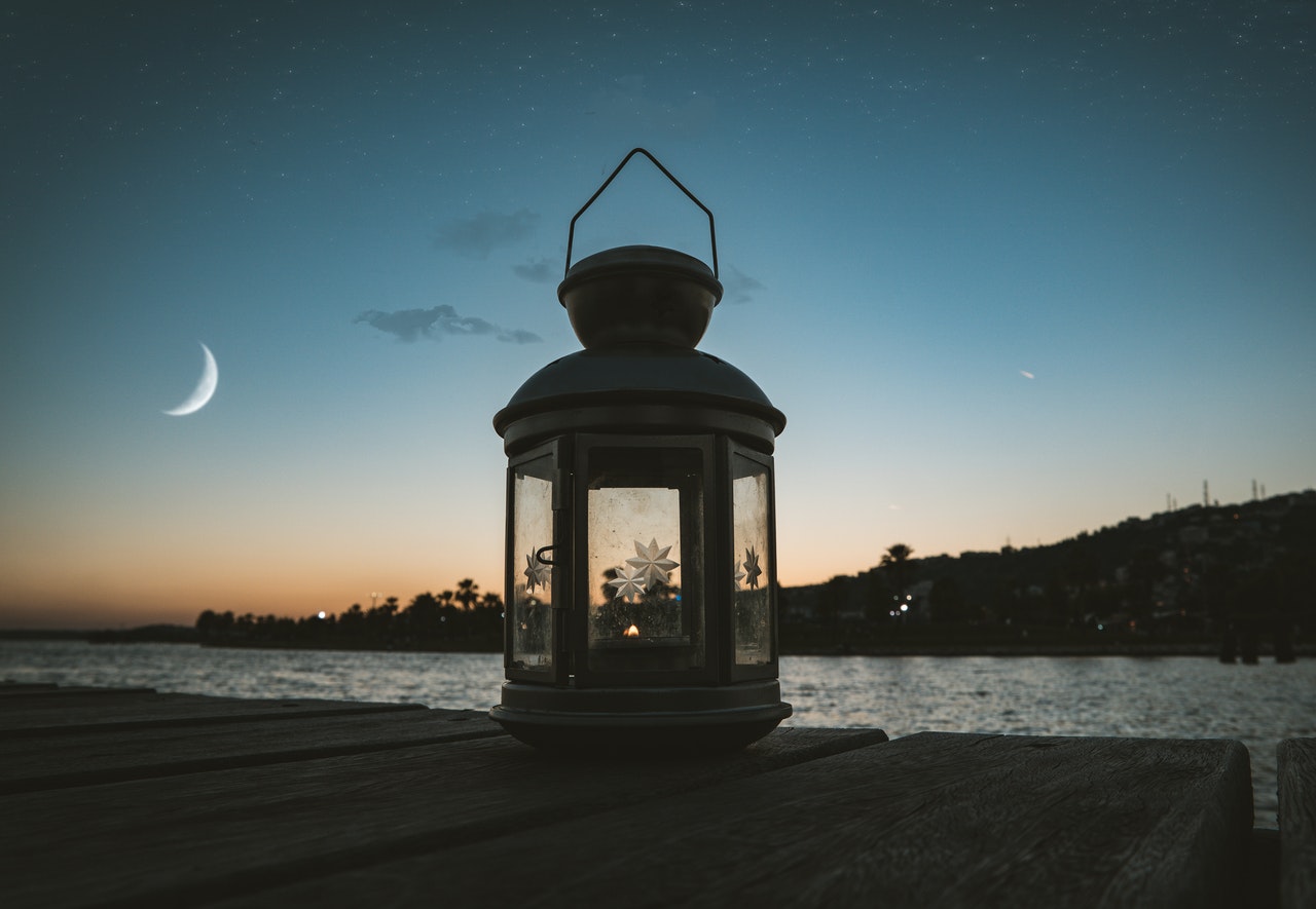 New Moon protocol - lantern shaped gazebo by the river banks with a sliver of moon showing.